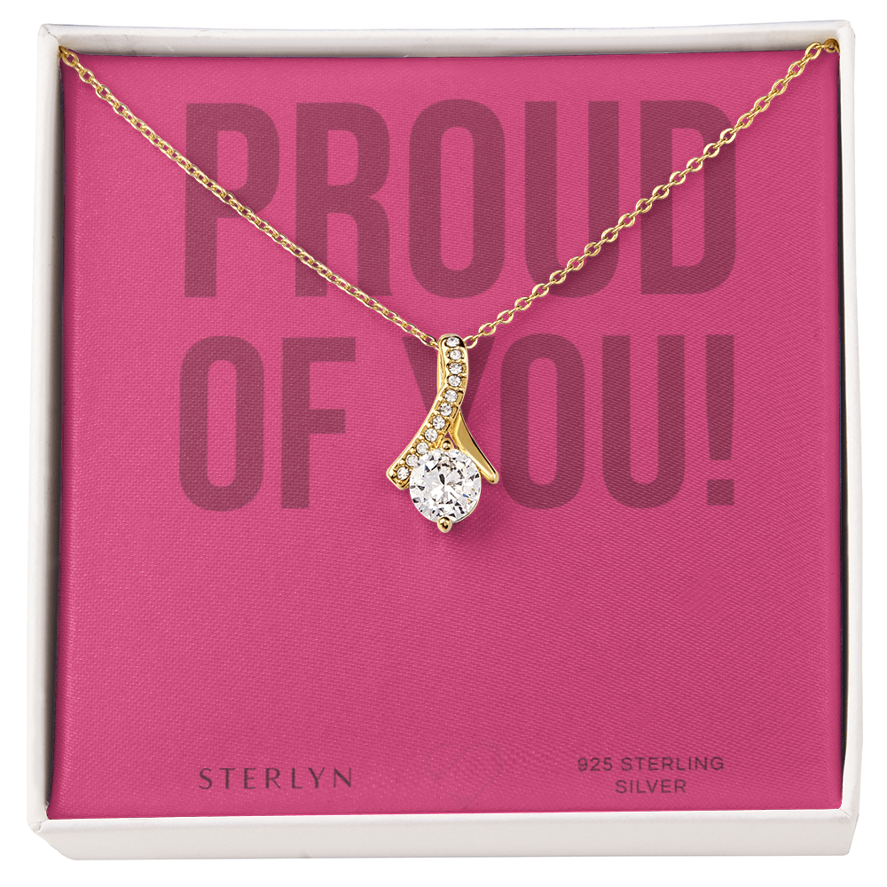 Wrapped in a bold “Proud of You!” message, This Thoughtful Gift Celebrates Their Journey With The Alluring Beauty pendent. "
